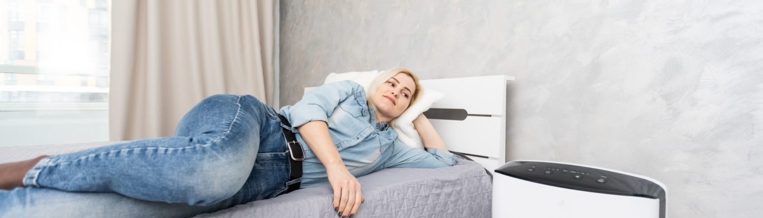 Woman Relaxing At Home With Working Air Humidifier 2024 08 27 17 16 12 Utc Scaled